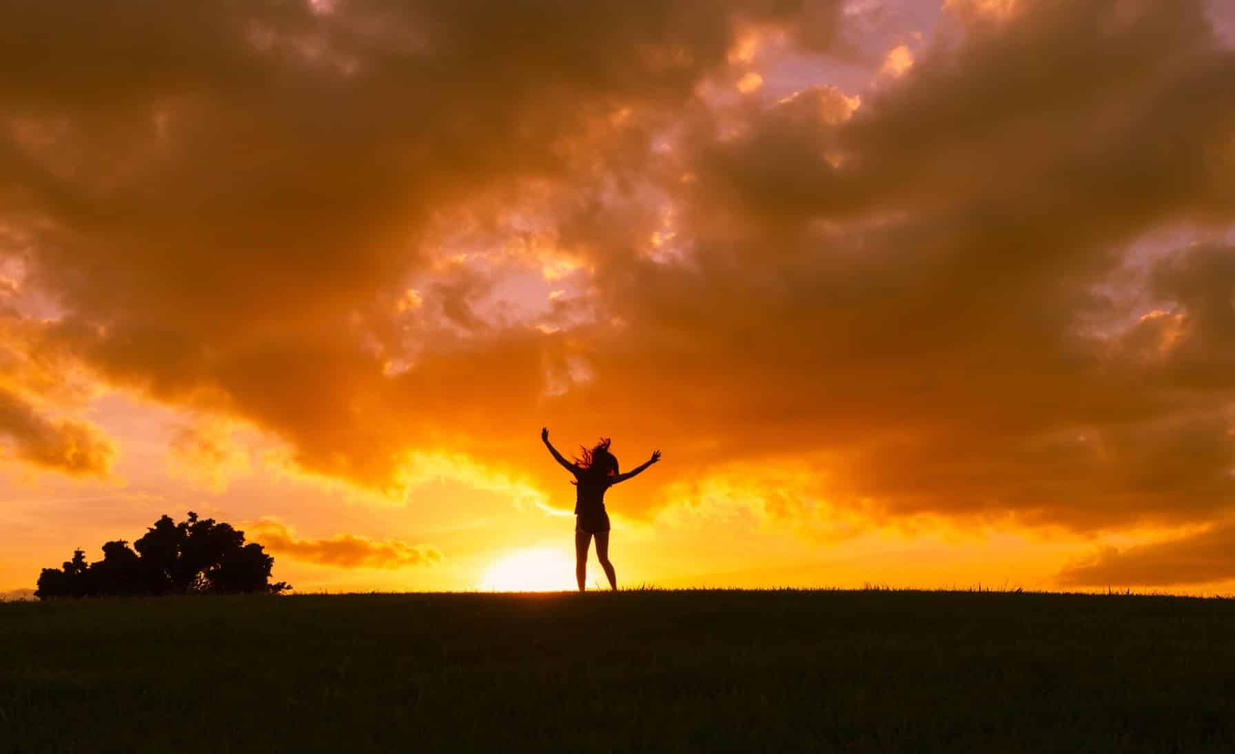 Image of the silhouette of a happy woman, free of depression