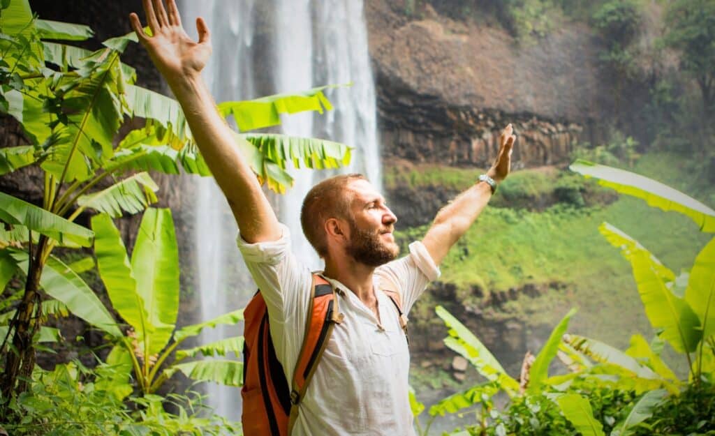 A man in the middle of refreshing foliage to resemble the act of detoxing/detoxifying your body with iv therapy