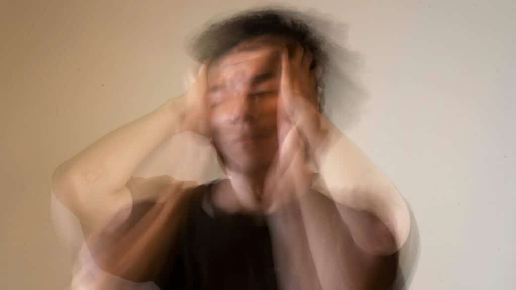 Blurred Image full of movement of a man experiencing severe depression