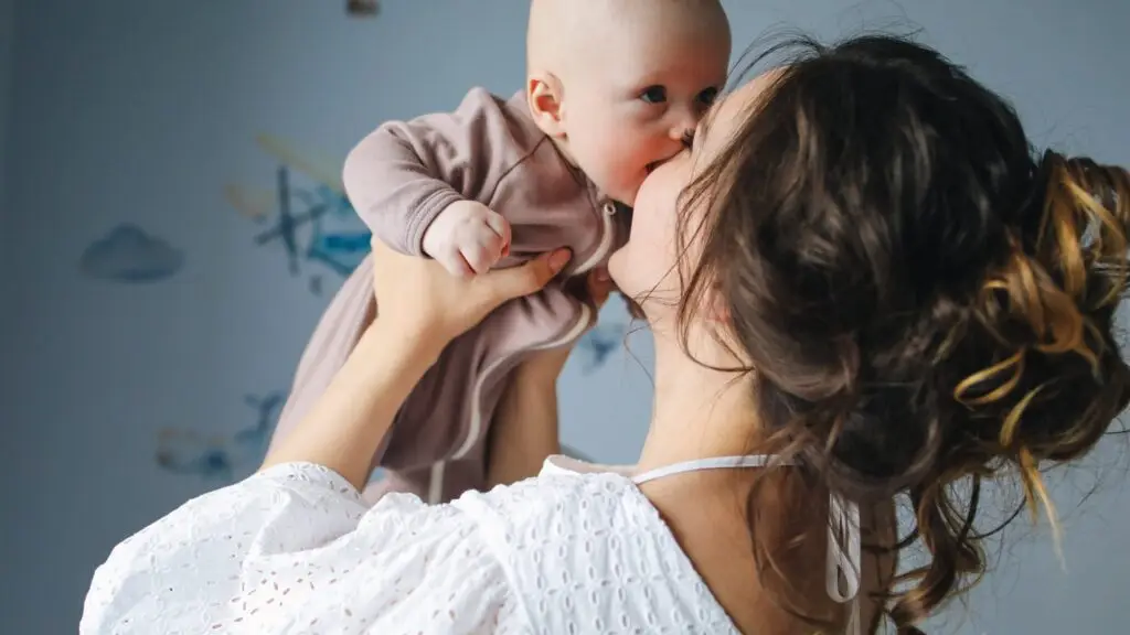 A mother loving on her baby after getting relief from Postpartum Depression (PPD)